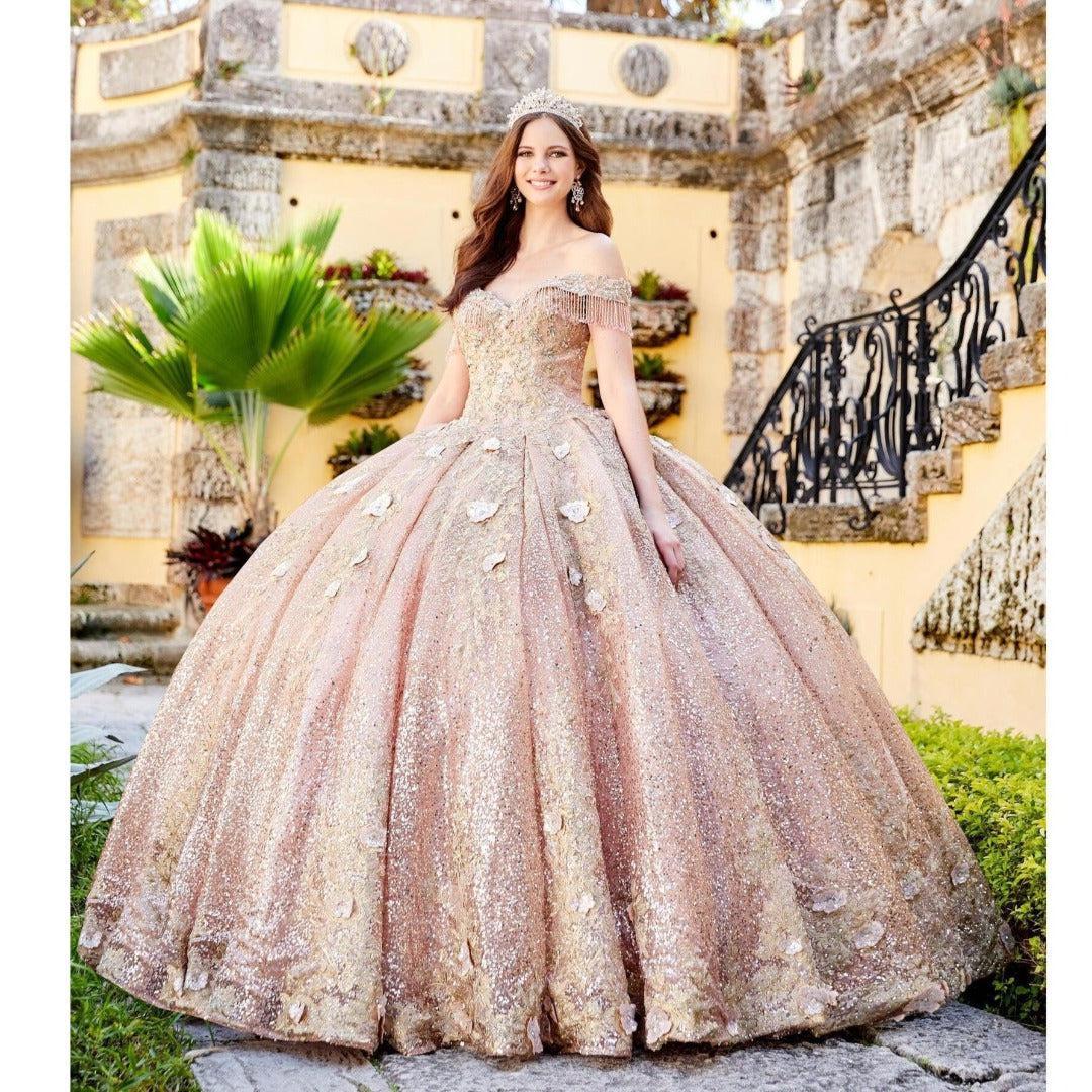 Image of rose gold colored quinceanera ball gown dress with fringe and embroidery.